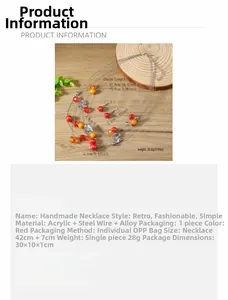 Detailed view of multilayer floral jewelry set with red and orange beads on steel wire