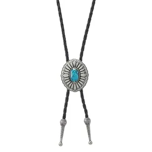 Vintage bolo tie with oval turquoise pendant and silver sunburst engraving on black leather cord