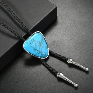 Western cowboy bolo tie featuring a triangle turquoise stone and black braided leather rope