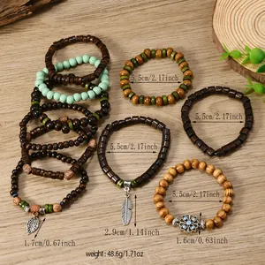 Detail view of multilayer coconut shell wood beads with leaf and feather metal charms
