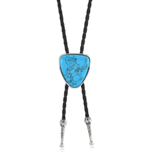 Detail of western bolo tie featuring a blue turquoise stone with silver metal tips