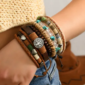 Macro detail of multi-layer bohemian bracelet with wood beads, leather and turquoise accents