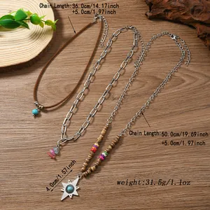 Detail view of Bohemian layered necklaces with turquoise and dimensions on wood