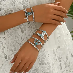 Ensemble de trois bracelets style western avec pierres turquoise et motifs de crâne