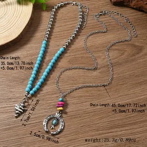 Detailed view of bohemian turquoise bead necklaces with cactus and horseshoe charms