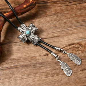 Vintage Silber Bolo Tie mit Türkis-Kreuz-Anhänger und Metallfedern an schwarzer Kordel
