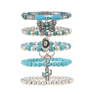 Five-piece bohemian stretch bracelet set with turquoise beads, butterfly and hat charms