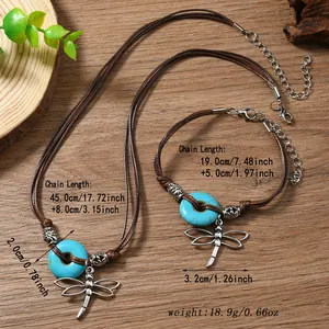 Close-up of vintage brown cord jewelry set with turquoise beads and dragonfly pendants