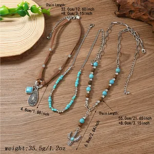 Detail of bohemian layered necklace set with turquoise beads and cactus charm