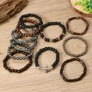Close-up of Bohemian multi-layer beaded bracelets with coconut shells and wooden cross pendant