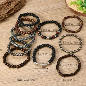 Detail of bohemian multilayer beaded bracelets with wood beads and silver cross charm