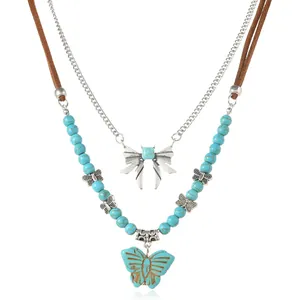Collier double rang avec pendentif papillon et perles de turquoise pour femme