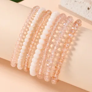 Close-up of 7-piece stretch bead bracelet set with champagne crystals and pearls