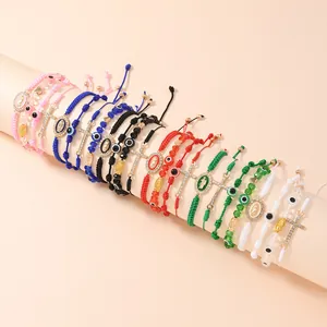 Set di bracciali intrecciati a mano con perline malocchio e ciondoli a forma di croce