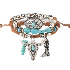Detail of bohemian layered bracelet with turquoise beads and silver bull head charm