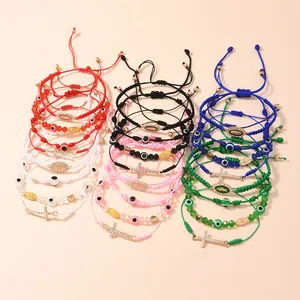 Bracciali intrecciati regolabili malocchio e croce in vari colori con ciondoli oro
