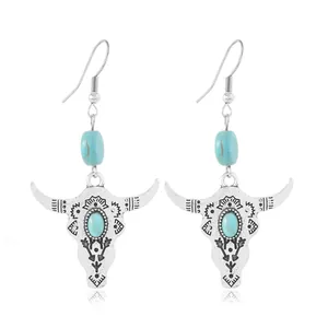 Bohemian silver earrings with turquoise beads and engraved bull skull pendants for women