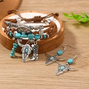 Bohemian jewelry set with turquoise beads, bull head charms and star boots on wooden base