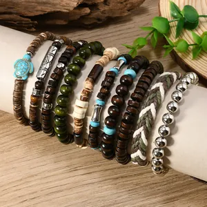 Detail of nine-piece bohemian bracelet set featuring coconut beads and blue turtle charm