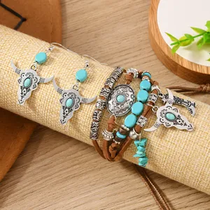 Detail of Bohemian set featuring bull skull charms and turquoise beads on burlap stand