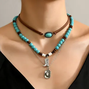 Bohemian multilayer necklace with turquoise beads, brown suede cord and silver boot pendant