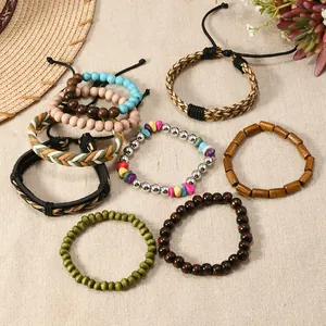 Macro detail of eight bohemian stretch bracelets with coconut beads and turquoise accents