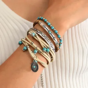 Bohemian multilayer stackable bracelet set with turquoise beads and sun charm