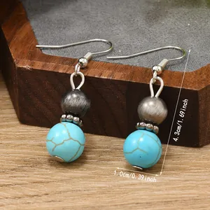 Detail of vintage turquoise earrings with silver hooks and 4.3cm length measurement