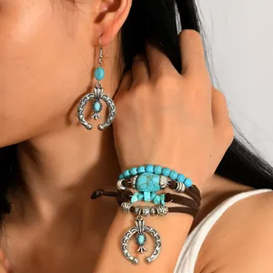 Bohemian turquoise jewelry set with silver horseshoe earrings and layered tassel bracelet