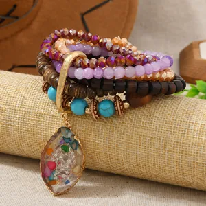 Bohemian multilayer beaded bracelet with faux turquoise and crystal teardrop pendant