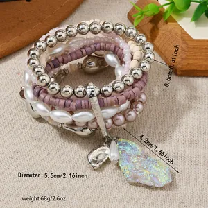 Bohemian stacked beaded bracelet set featuring purple beads and a large stone pendant