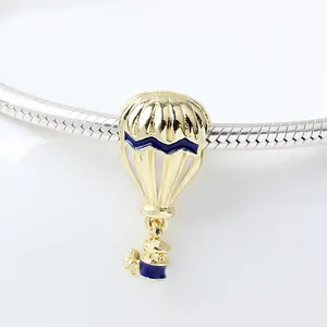 Golden hot air balloon charm with dark blue and white enamel for snake chain bracelet
