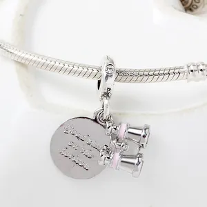 Binocular and round charm pendant with 'Good times on the horizon' text on silver snake chain
