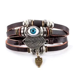 Vintage multilayer leather bracelet with turquoise evil eye and owl leaf charms