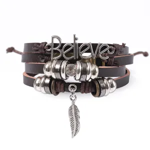 Vintage layered leather bracelet with silver 'Believe' charm and feather pendant