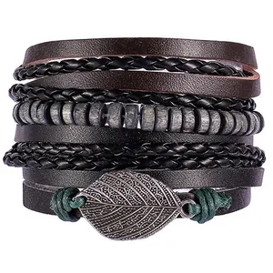 Macro shot of layered leather bracelet with dark wooden beads and vintage silver leaf charm