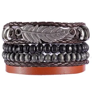 Detail of vintage multilayer leather bracelet with silver feather and turquoise beads