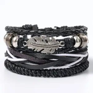 Vintage mehrlagiges Lederarmband mit silbernem Federanhänger und Türkis Akzenten