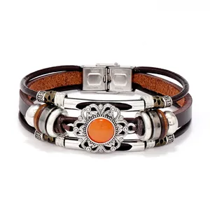 Detail of multi-layer leather bracelet with orange stone and stainless steel clasp