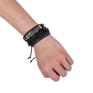 Detail of multi-layer leather bracelet with bronze feather charm and turquoise stone