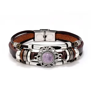 Macro detail of multi-strand leather bracelet with purple stone and steel clasp