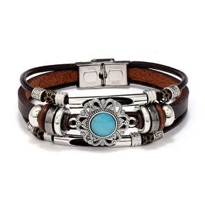 Detail of multi-layer leather bracelet with blue cat eye stone and stainless steel magnetic clasp