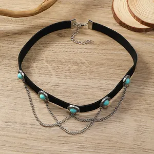 Detail of bohemian black choker with turquoise stones and silver chain tassels