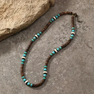 Detail of bohemian turquoise and coconut shell beaded necklace with adjustable metal chain