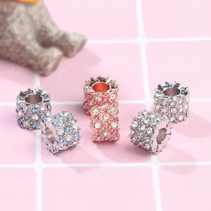 Macro shot of sparkling crystal charms with silver and rose gold metal bases and rhinestones