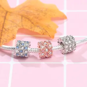 Silver snake chain bracelet with blue and pink pavé crystal cylinder charms