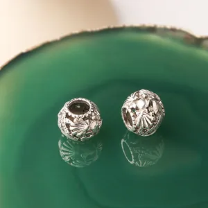 Perles de charme océan évidées en argent avec motifs d'étoiles de mer sur agate verte