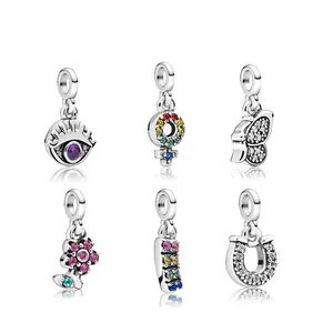 Colgantes de herradura y ojo turco en plata con circonitas cúbicas de colores