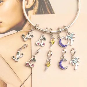 Silver charm bracelet set with colorful rhinestone lightning, cactus and moon pendants