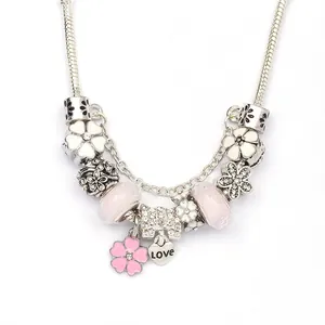 DIY charm bracelet with white magnolia, pink glass beads and silver LOVE heart pendant